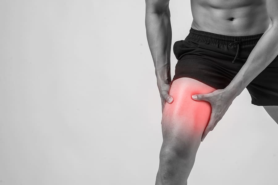 young-sport-man-with-strong-athletic-legs-holding-knee-with-his-hands-pain-after-suffering-ligament-injury-isolated-white (1) (1)